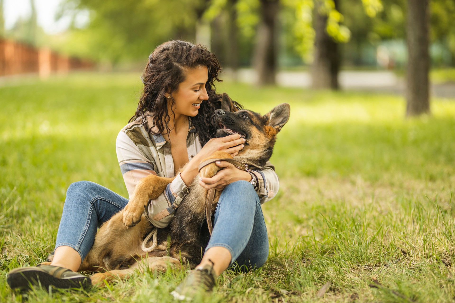 Woman playing with her dog at the park
